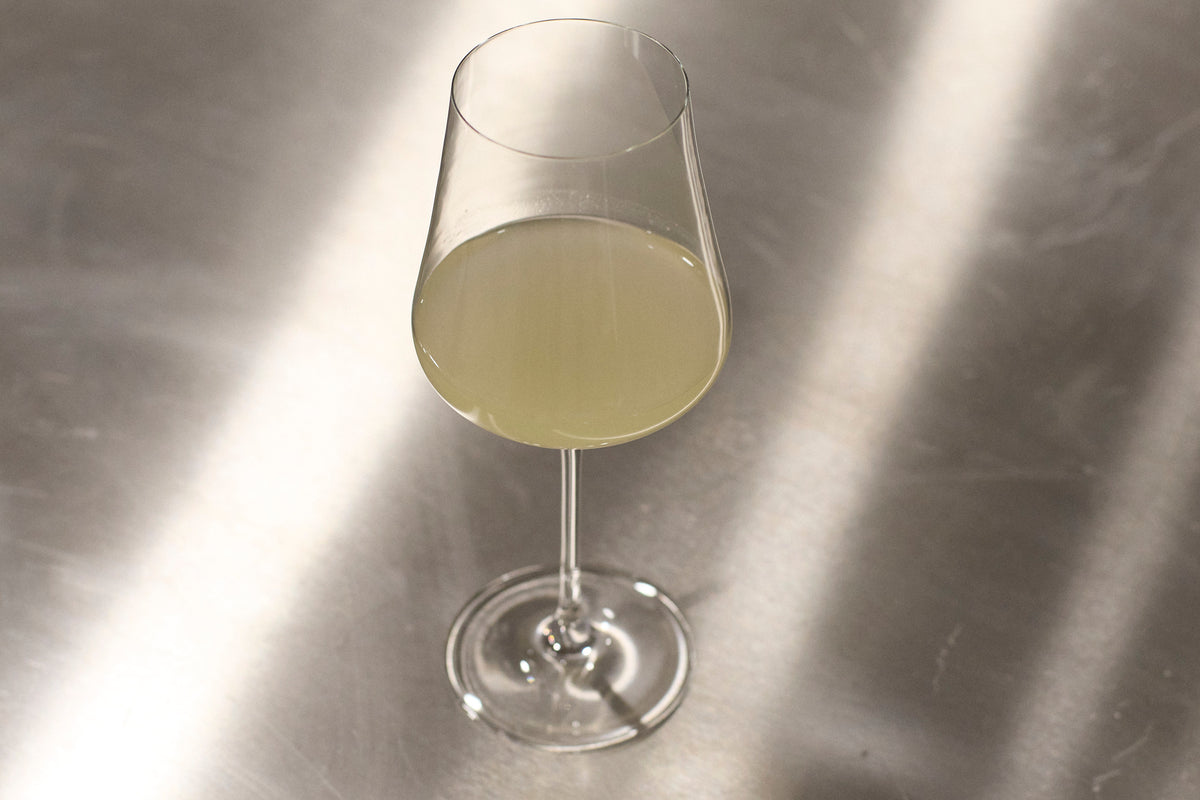 Nigori cloudy sparkling sake by Reigen Fermentation served in a glass
